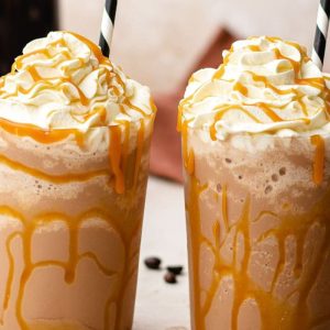 Rich espresso blended with creamy milk and sweet caramel,topped with whipped cream and caramel drizzle